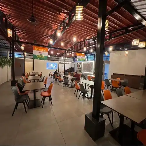 Dining area with warm lights and rustic décor, ideal for family dining